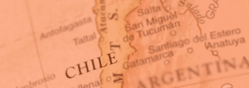 Close-up of a vintage-style map highlighting Chile and parts of Argentina, with the word "CHILE" in bold capital letters near the center.