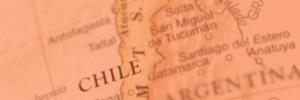 Close-up of a vintage-style map highlighting Chile and parts of Argentina, with the word "CHILE" in bold capital letters near the center.