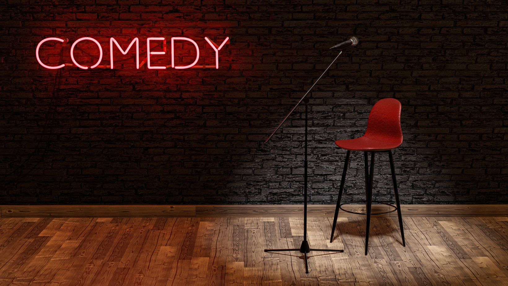 A dark stage with a red chair and a sign that reads "Comedy"