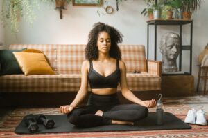 Black woman meditating.