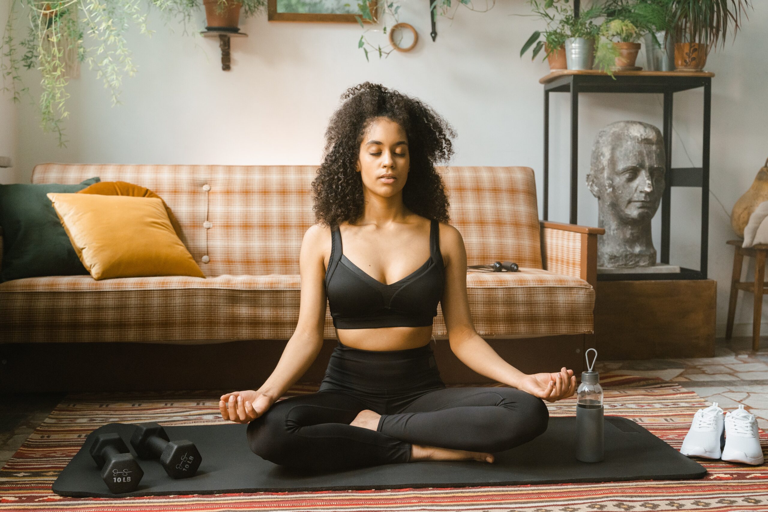 Black woman meditating, how to let go of OCD thoughts.