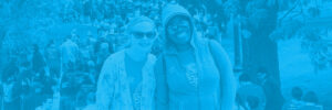 Image of a black woman and a white woman smiling, wearing and IOCDF OCD Walk shirt.