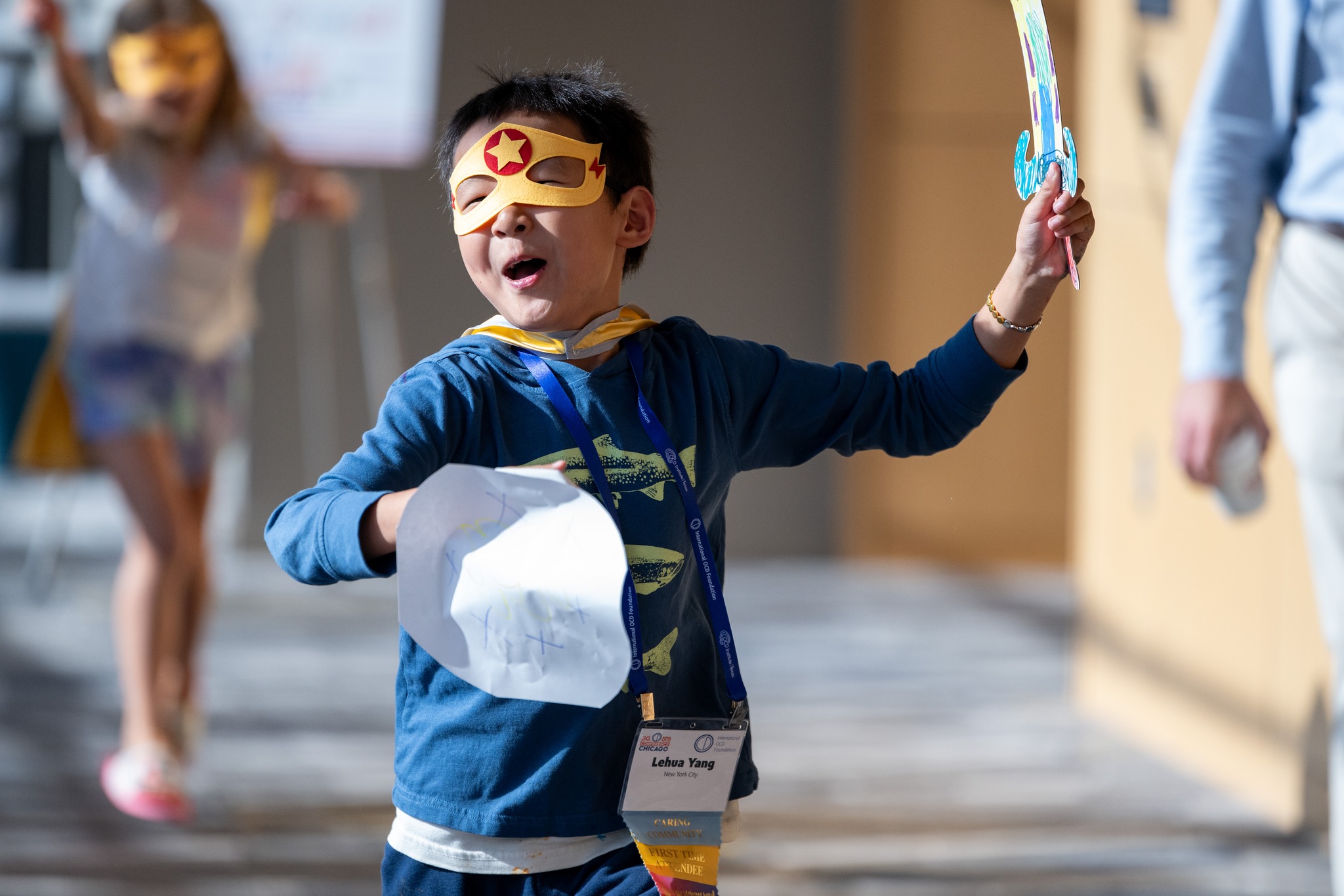 Child with superhero costume at IOCDF annual conference