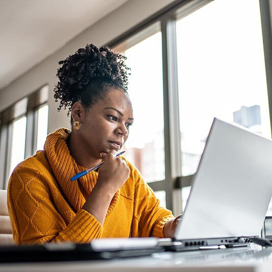 Black woman working from home office square