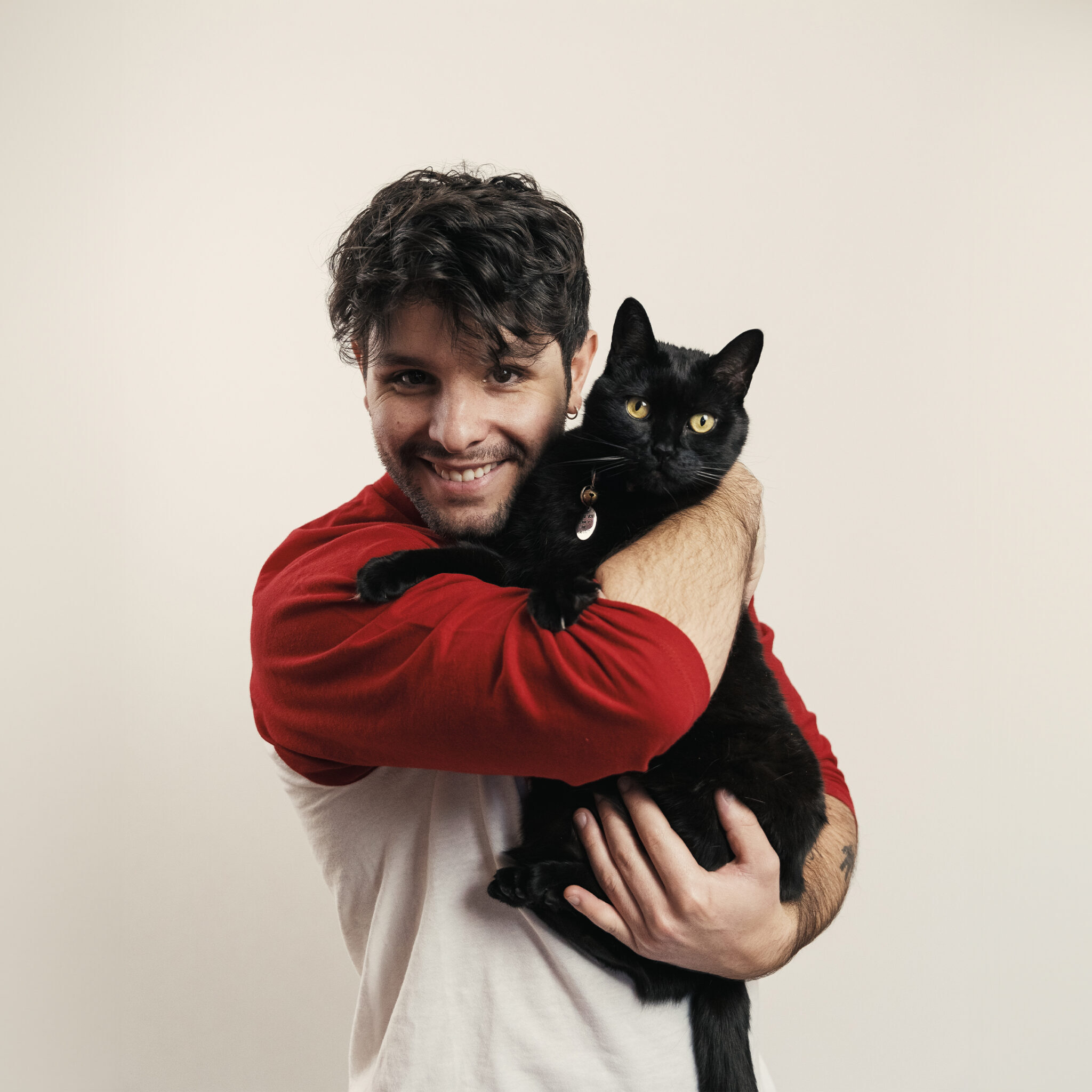 Tyler Falcoa 6.10.25 Brown haired white man holding a cat.